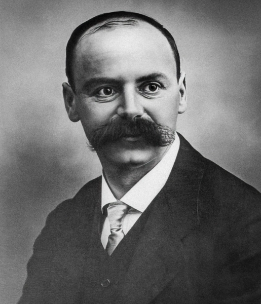 Изображение может содержать лицо Карла Шварцшильда, голову, портрет, взрослый, усы, одежда и официальная одежда.