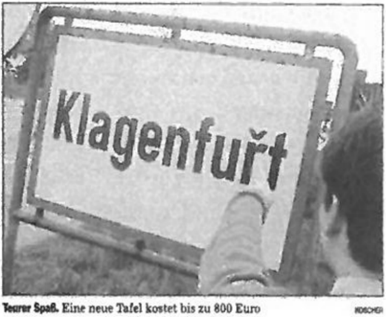 Каринтийский дорожный знак, «словенизированный» при помощи наклейки