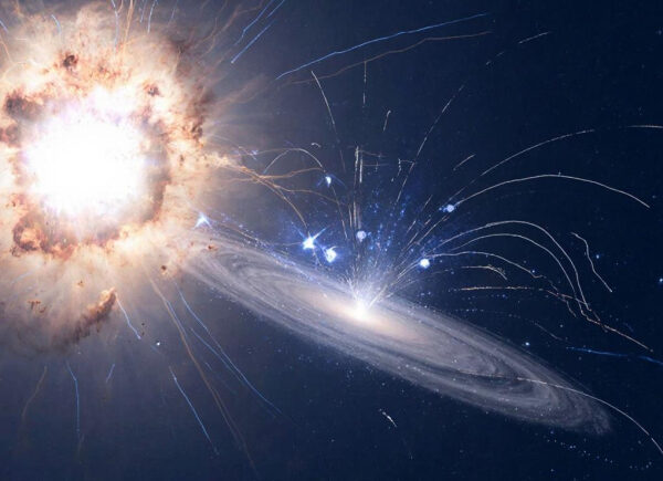 Космический взрыв рядом с вращающейся галактикой на фоне звёздного неба.