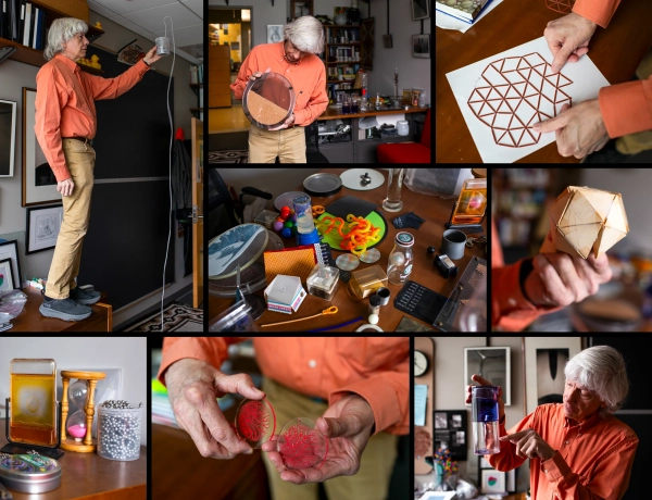 Нагель играет с разнообразными игрушками в своем офисе.