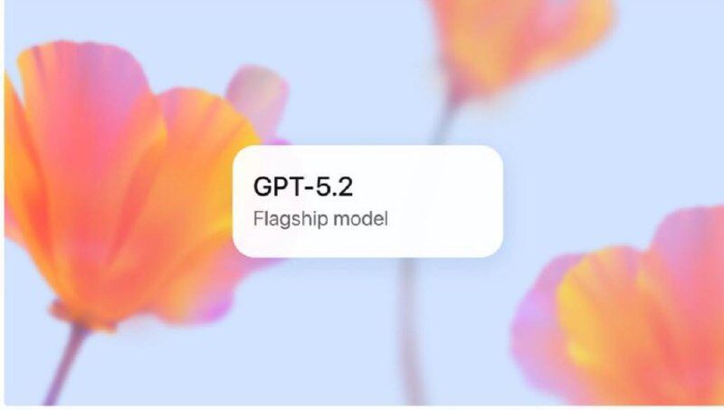 Цветы на фоне и надпись "GPT-5.2 Flagship model" на светлом фоне.