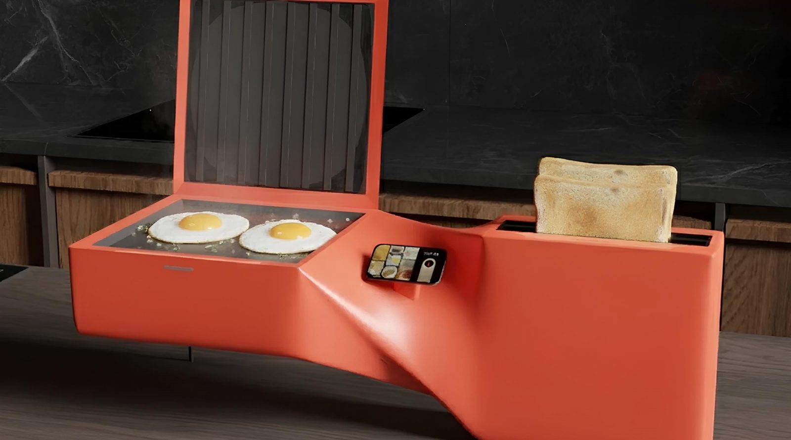 Ярко-оранжевый кухонный прибор с яичницей и тостами на черной столешнице.