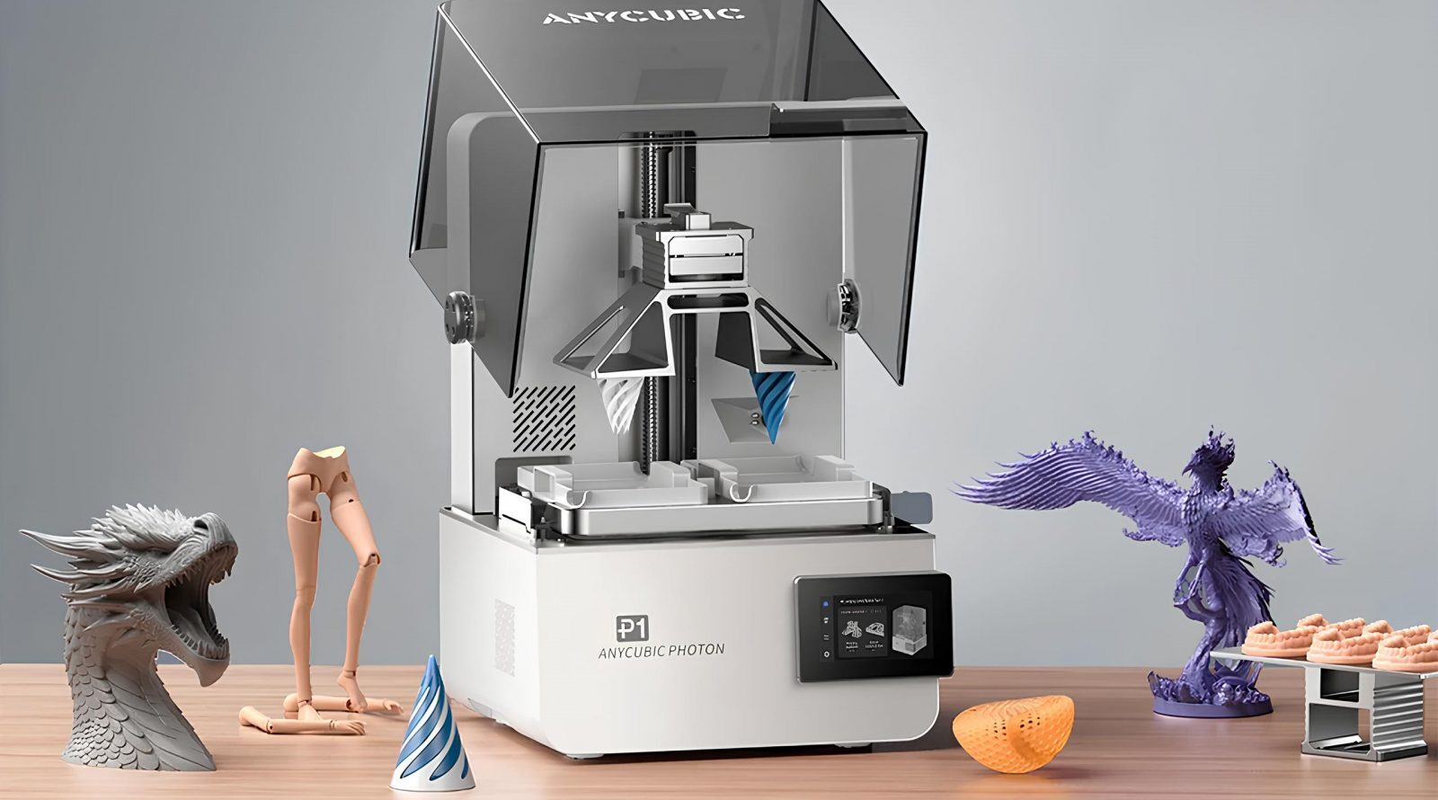 Photon P1 — новый уровень 3D-печати 3 3D-принтер Anycubic Photon с фигурками на столе.