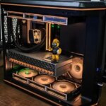 Игровой компьютер с подсветкой и фигуркой внутри корпуса.