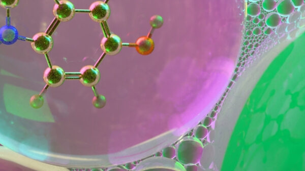 Абстрактная молекулярная структура на фоне пузырей в розово-зеленых тонах.