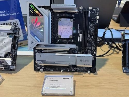 Материнская плата AMD Ryzen X570 на выставке, видна панель с логотипом.