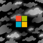 Логотип в цвете на фоне серых облаков и черного неба.