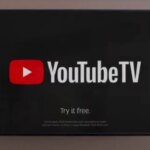 Логотип YouTube TV на черном фоне с текстом "Try it free".