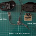 Разобранная мышь: RP2040-ZERO, плата USB-хаба, стандартная плата мыши.