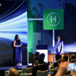 Презентация компании Hoymiles: выступление перед аудиторией на фоне логотипа.