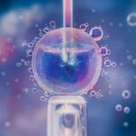 Клетка под микроскопом, процесс деления, исследование в лаборатории, наука.