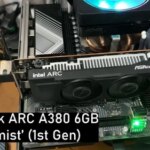 Графическая карта ASRock ARC A380 6GB Alchemist на материнской плате с фигуркой аниме.