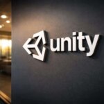 Логотип Unity на стене в офисе, 3D буквы, вечернее освещение.