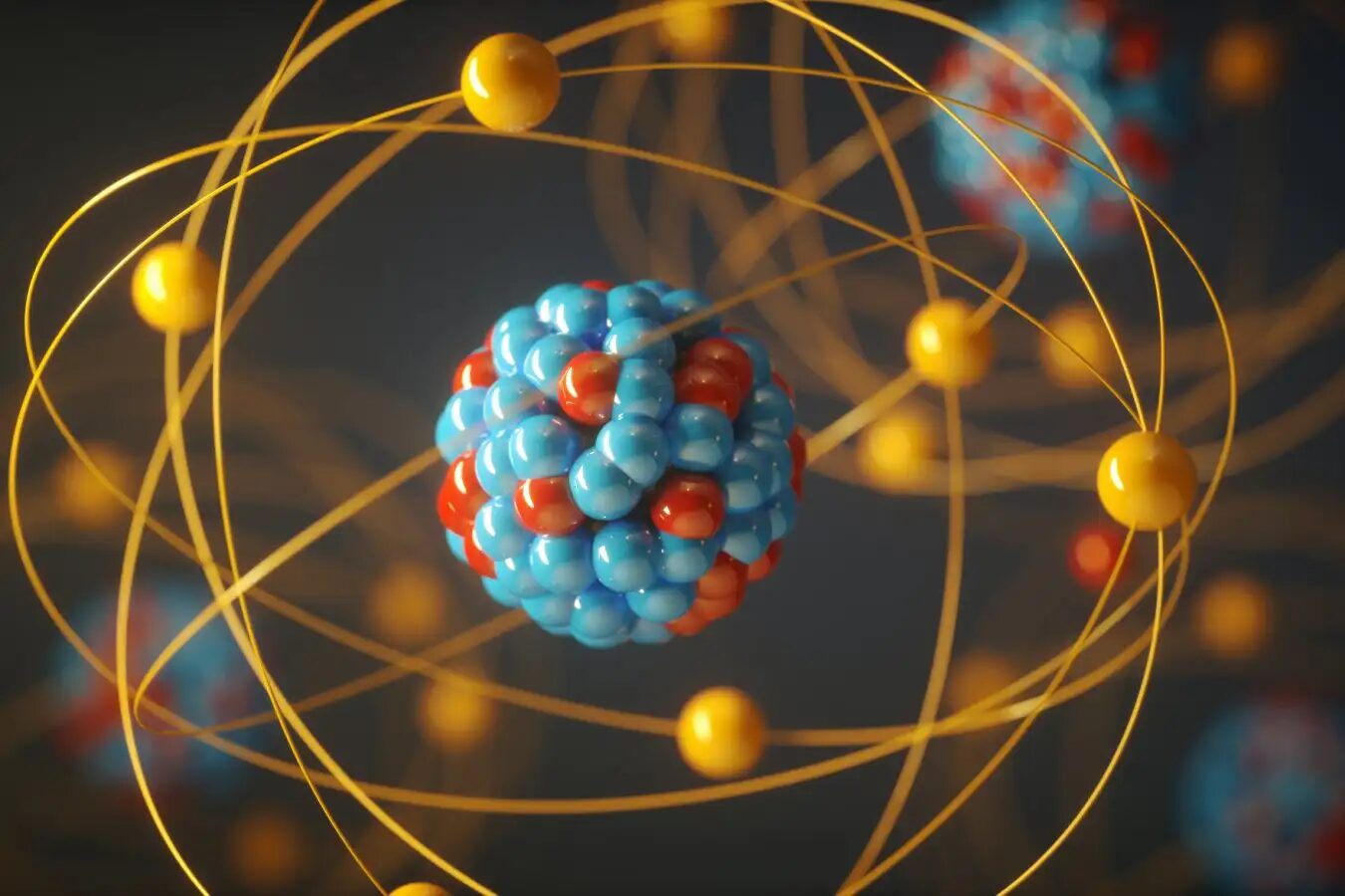 Модель атома с ядром и вращающимися электронами на темном фоне.