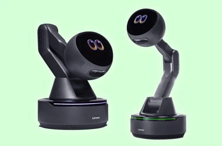Два робота Lenovo с черными корпусами и светящейся панелью на светло-зеленом фоне.