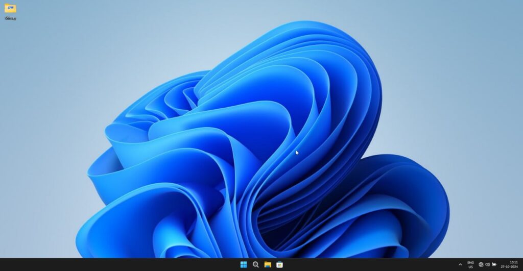 Ускоряем и чистим Windows за один клик — появился проект... 1 Рабочий стол Windows 11 с фоном в виде синей абстракции и панелью задач внизу.