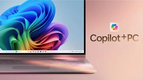 Ноутбук с Windows и логотипом Copilot+PC на экране, абстрактные цвета обоев.