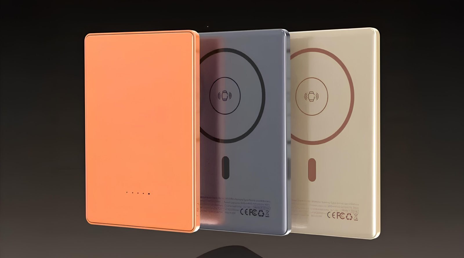 Три беспроводные зарядные батареи разного цвета на темном фоне.