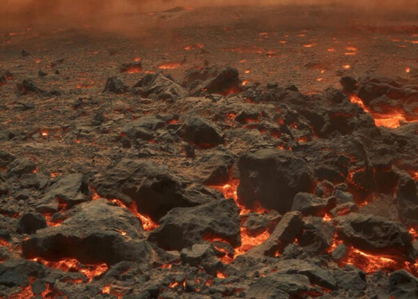 Извержение вулкана: лава и дымящиеся камни на поверхности, горячий рельеф.