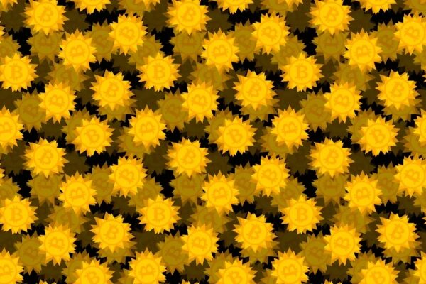 Золотые логотипы биткоина, изображенные на монетах с острыми концами на затемненном черном фоне.