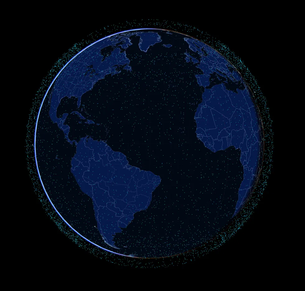 Изображение спутниковой системы Starlink, представленной в виде ярких точек, окружающих Землю.