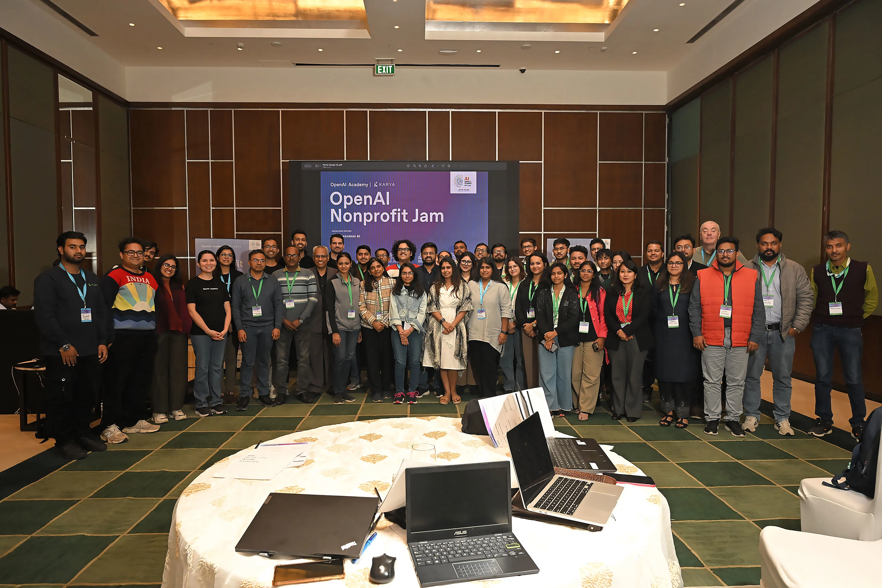 Два года обучения в OpenAI Academy | OpenAI 2 Участники позируют для группового фото на мероприятии OpenAI Nonprofit Jam.